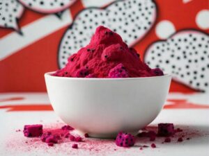 Red Dragonfruit Powder on a white bowl with a red and white pop art background