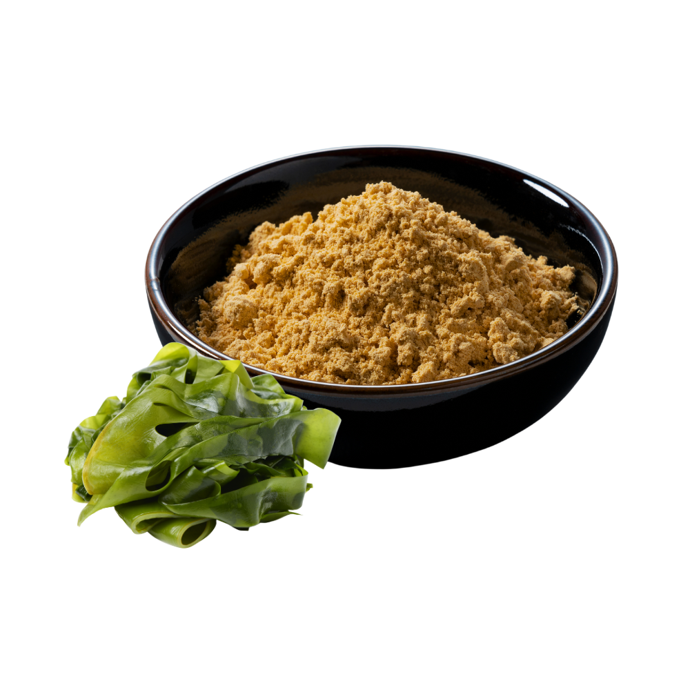 Brownish colored powder in a black bowl beside a green kale leaf.