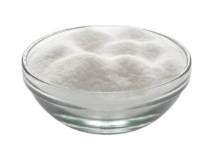 White, small granules that resemble sugar in a transparent bowl.