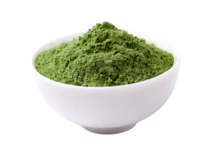 Dark green powder in a white bowl