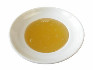 Golden syrup in a bowl.