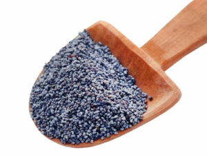 Poppy seeds displayed on a wooden spoon