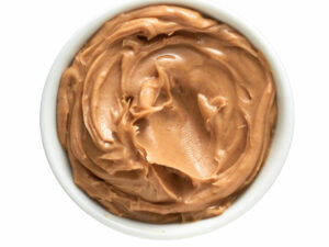 Jar of peanut butter shown from the top view.