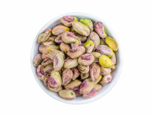 Top view of whole pistachios in a bowl.