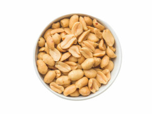 Top view of split peanuts in a bowl.