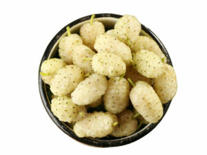 Top view of white mulberries heaped in a bowl.