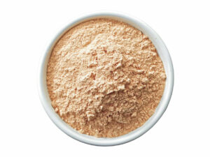 Top view of pinkish white powder in a bowl.