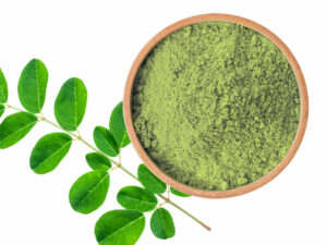 Top view of green powder in a bowl.