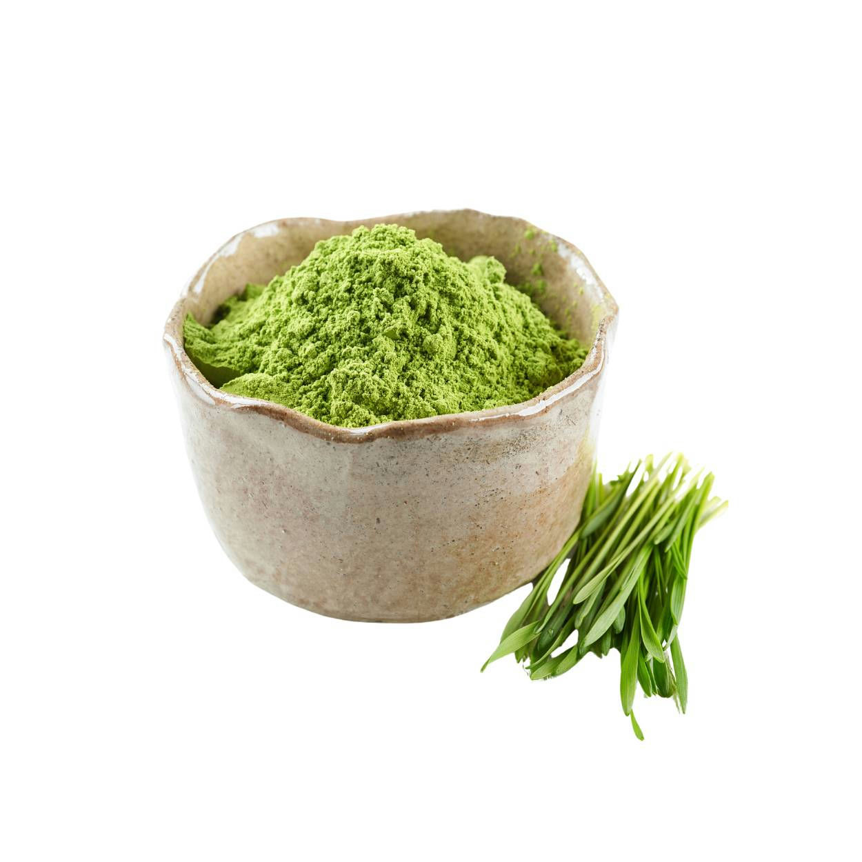 Green powder in a bowl beside some green grass.
