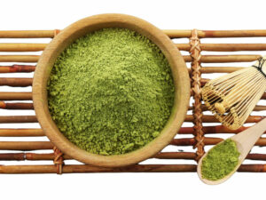 Top view of vibrant green powder ina a bowl.