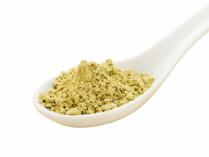 Fine green powder on a spoon.