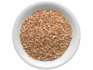 Top view of grapefruit peel granules in a bowl.