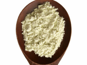 Fine white powder displayed on a wooden spoon .