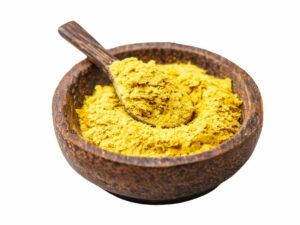 Golden, yellow powder in a wooden bowl.