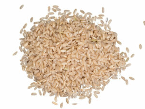 Top view of brown rice in a heap.