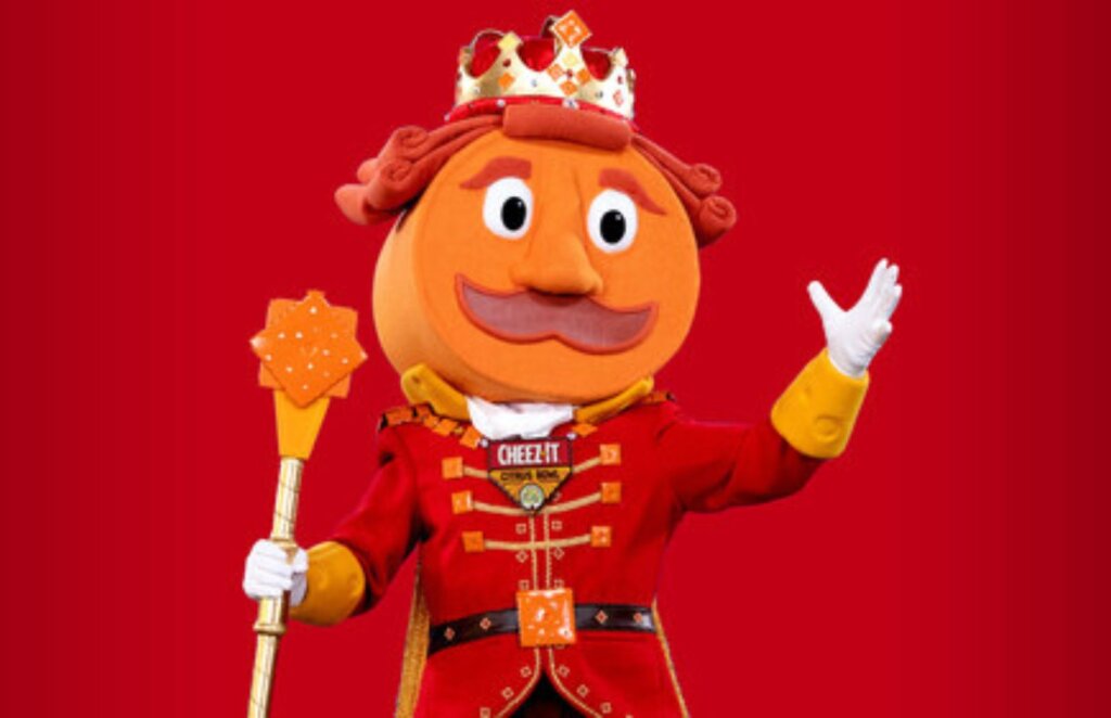 Cheez-It Prince Cheddward mascot character in red royal uniform with crown, cracker scepter for college football bowl sponsorship
