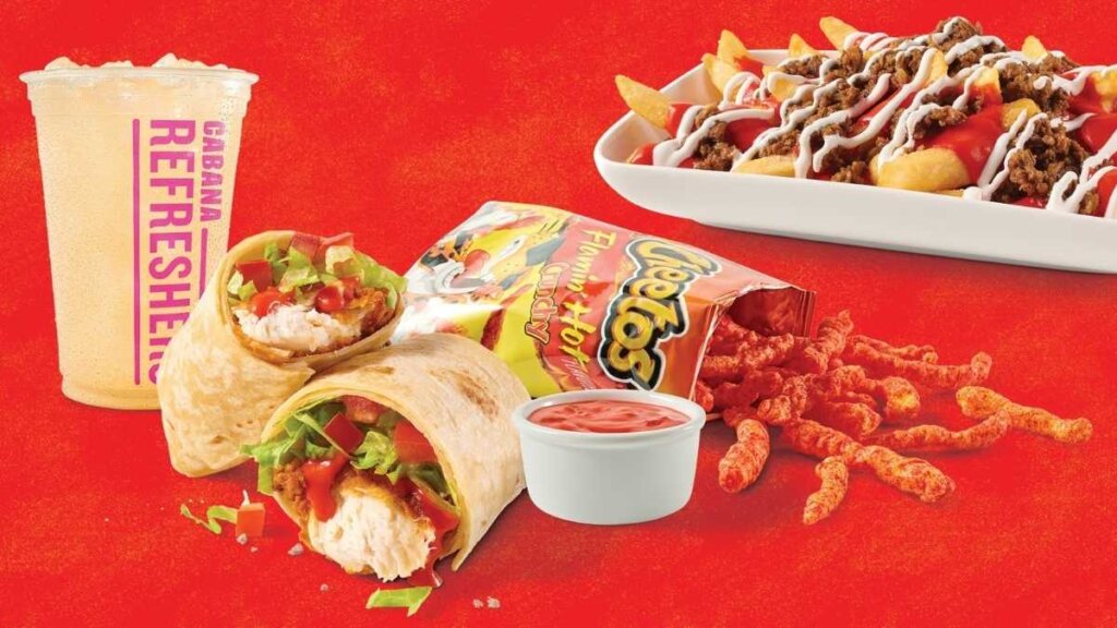 A promotional spread of the $9.99 Wrap Meal, featuring the red queso dip, a bag of Flamin' Hot Cheetos, and the Queso Rojo Wrap next to a cold Cabana Refresher.