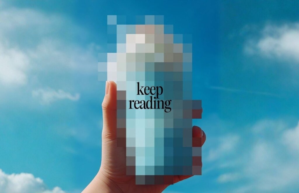 A hand holds something that cannot be seen because it's blur, with the words "keep reading" on its cover