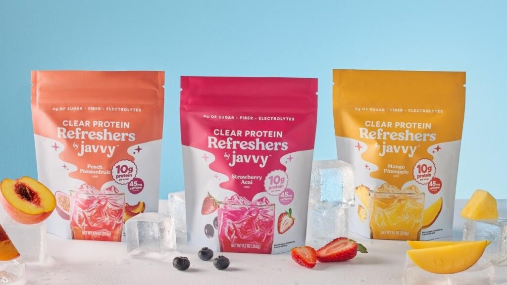 A translucent Mango Pineapple Javvy Clear Protein Refresher showing a crisp, juice-like texture.