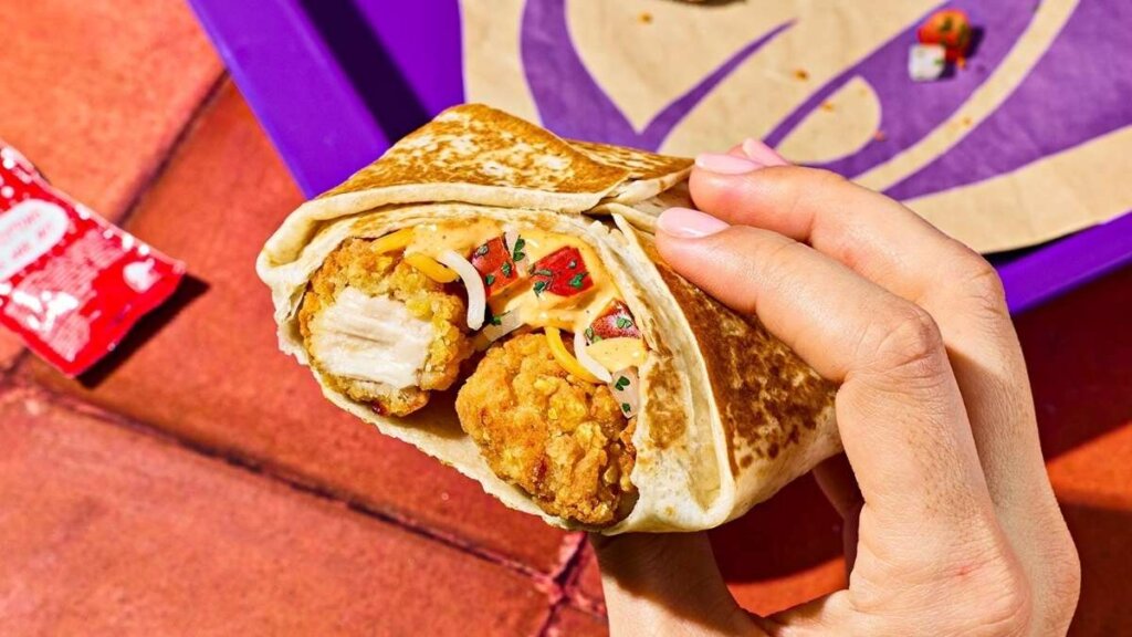 A close-up of the Taco Bell Cantina Chicken Bowl featuring roasted chicken, purple cabbage, and Avocado Verde Salsa.