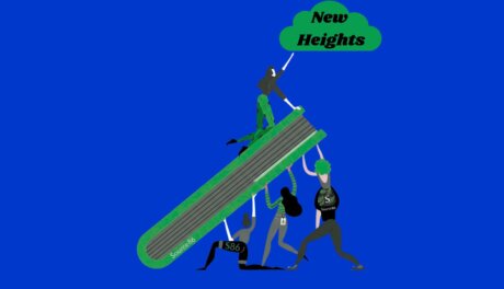 A Source86 group of people lifting a large green ramp with a person reaching "new heights"