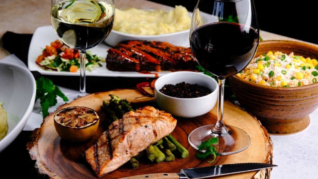 Juniper Grill interior at 2350 Railroad Street in Pittsburgh's Strip District, featuring California-inspired American cuisine with wood-fired scratch cooking, opened April 2026 by Restaurant Holdings LP