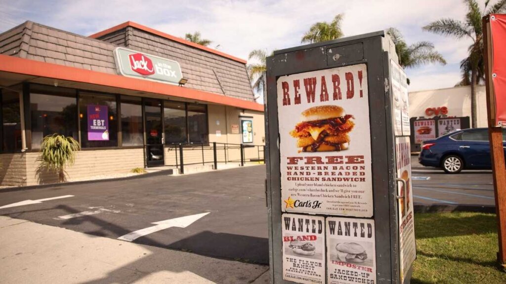 Carl's Jr. Western Bacon Chicken Sandwich featuring buttermilk chicken fillet, Cherrywood bacon, American cheese, crispy onion rings, and Western BBQ sauce, launched April 2026