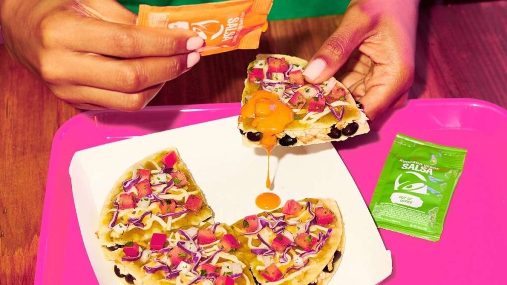 Taco Bell Cantina Chicken Mexican Pizza launching nationwide May 21 2026 featuring slow-roasted Cantina Chicken, black beans, green chile sauce, three-cheese blend, shredded purple cabbage, and pico de gallo on crispy tortilla shells, served with new Jalapeño Citrus Salsa sauce packet

