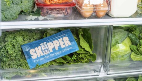 Skipper Fridge Hydration device placed inside a refrigerator crisper drawer to help preserve fresh produce and reduce food waste