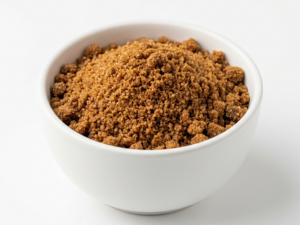Date Sugar on a white ceramic bowl over a white background