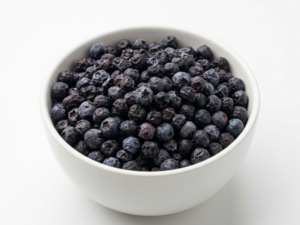 Bulk Freeze Dried Blueberry Pieces inside White Ceramic Bowl