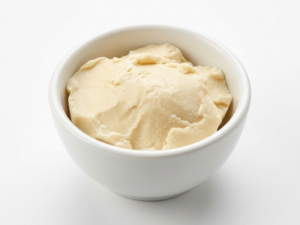 Bulk Cocoa Butter on a white ceramic bowl