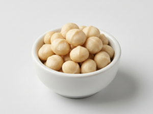 Macadamia nuts on a white ceramic bowl